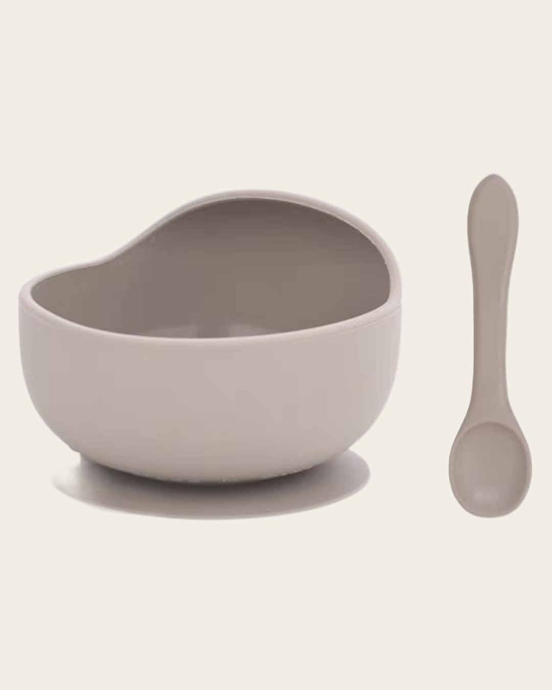 Gray bowl and spoon set on a light beige background
