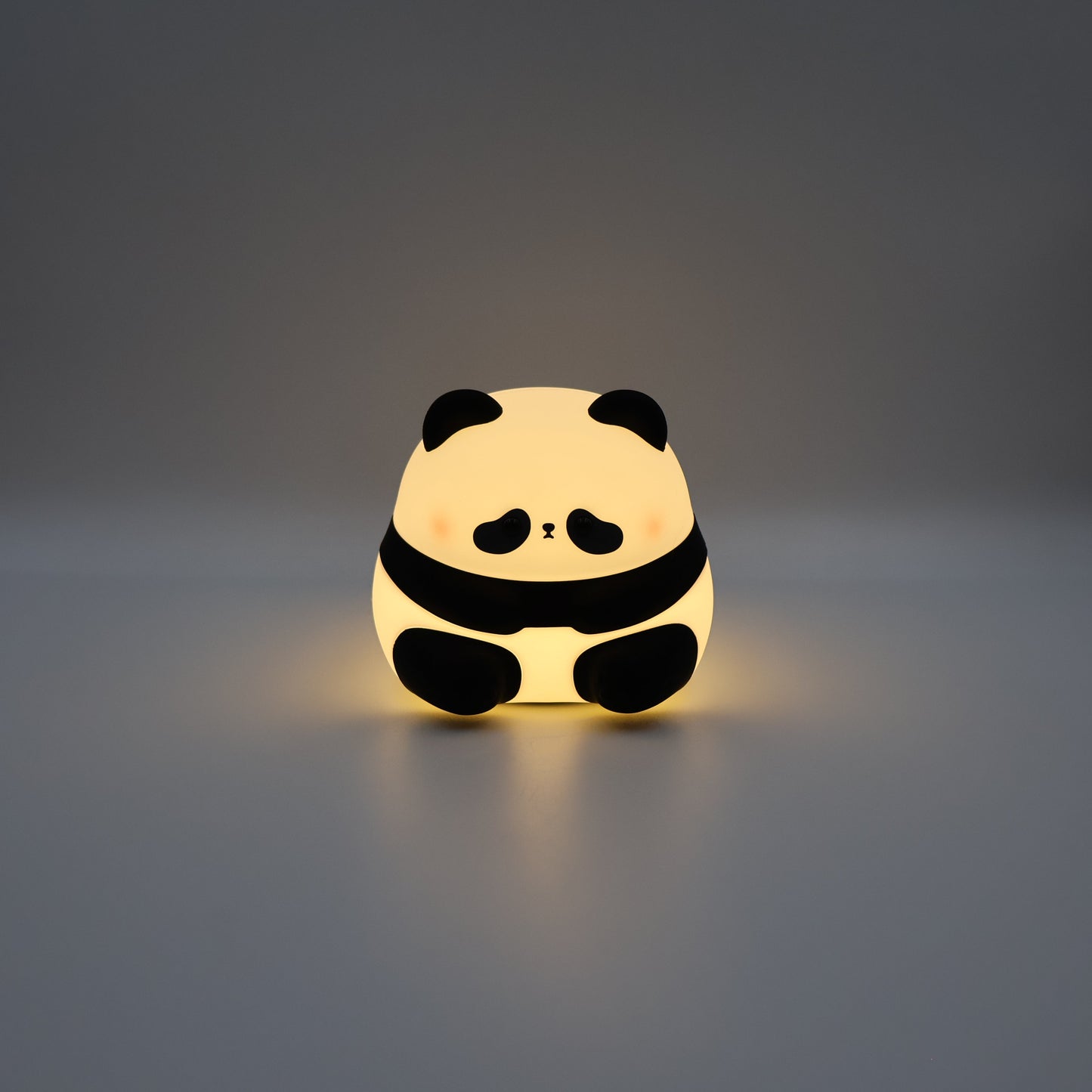 Panda night light on a grey background