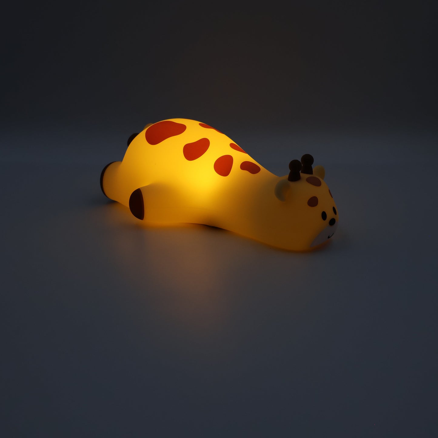 Giraffe night light on a dark background