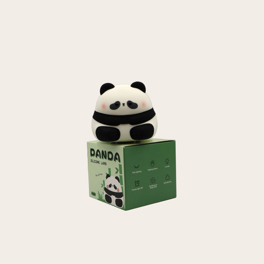 Panda night light on a green box with against a grey background